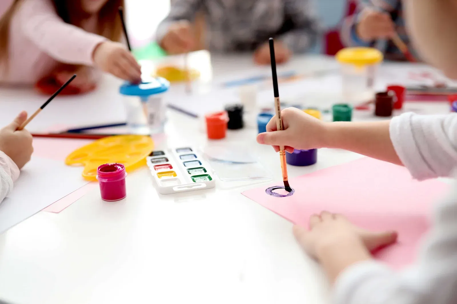 Children painting together at an Art for Kids workshop